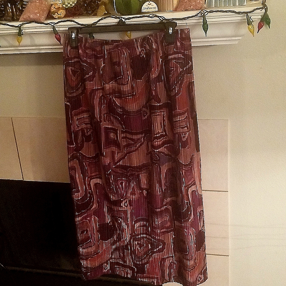 This skirt is by Paris Pleats in large. Burgundy